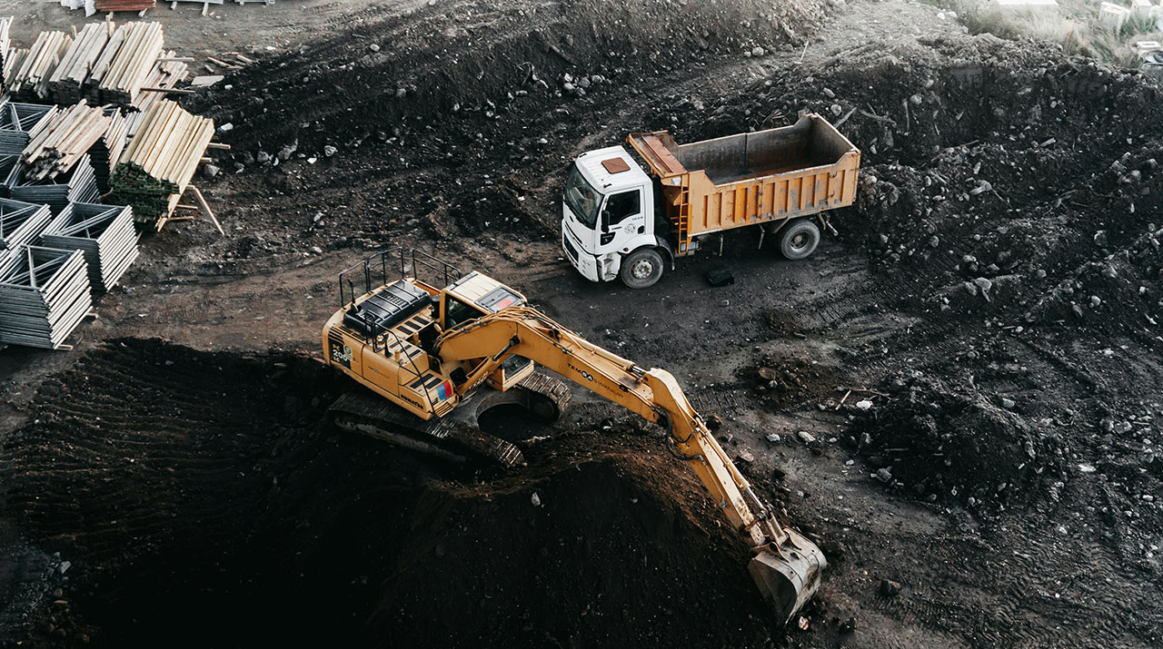 A panoramic view of a mining operation, symbolizing a strategic partnership for long-term growth.